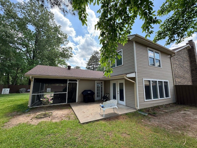 back of house with a lawn, fence, and a patio area