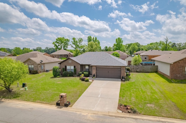 21 Lilly Ann Cir, Ward, AR 72176 - view of front facade with brick siding, a front lawn, fence, and a residential view