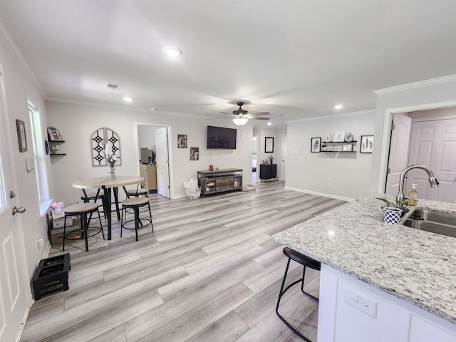 505 E Mississippi St, Beebe, AR 72012 - living room with crown molding, ceiling fan, recessed lighting, light wood-style flooring, and baseboards
