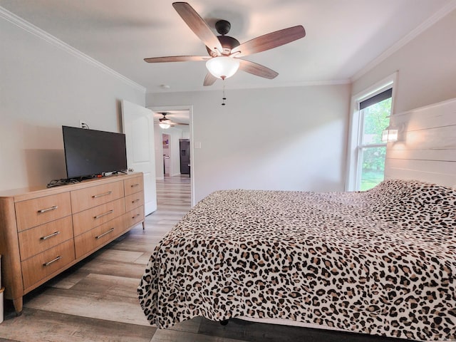 505 E Mississippi St, Beebe, AR 72012 - bedroom featuring light wood-style floors, ornamental molding, and ceiling fan