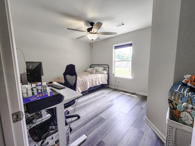 505 E Mississippi St, Beebe, AR 72012 - bedroom with wood finished floors, baseboards, and a ceiling fan