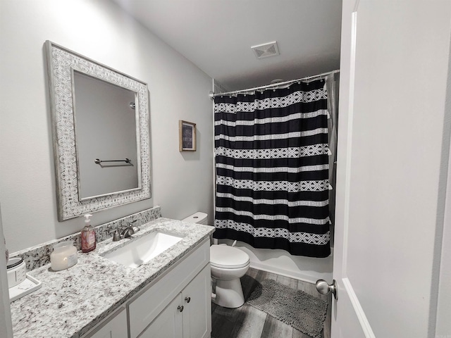 505 E Mississippi St, Beebe, AR 72012 - bathroom featuring toilet, vanity, and wood finished floors