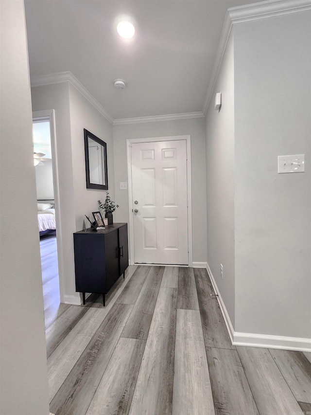 505 E Mississippi St, Beebe, AR 72012 - foyer featuring wood finished floors, crown molding, and baseboards