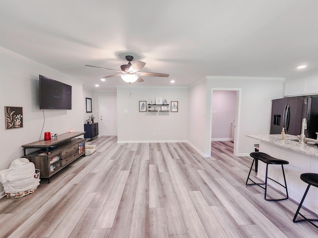 505 E Mississippi St, Beebe, AR 72012 - living room featuring a ceiling fan, light wood-type flooring, recessed lighting, ornamental molding, and baseboards