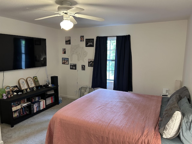 carpeted bedroom featuring a ceiling fan