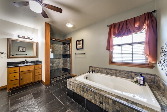 bathroom with a garden tub, ceiling fan, a stall shower, and vanity