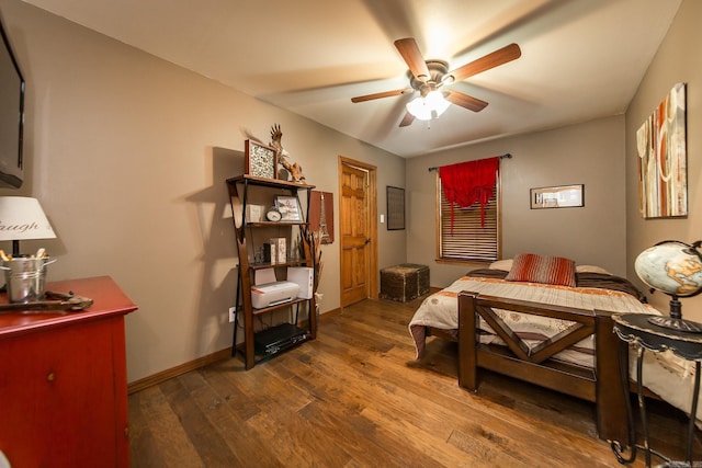 bedroom with baseboards, a ceiling fan, and wood finished floors
