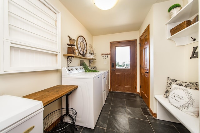 washroom featuring laundry area and washer and clothes dryer