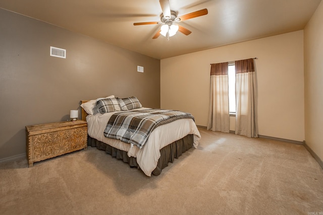 bedroom featuring baseboards, visible vents, light carpet, and ceiling fan