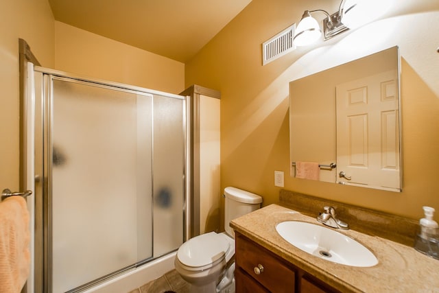 full bath featuring vanity, a stall shower, toilet, and visible vents