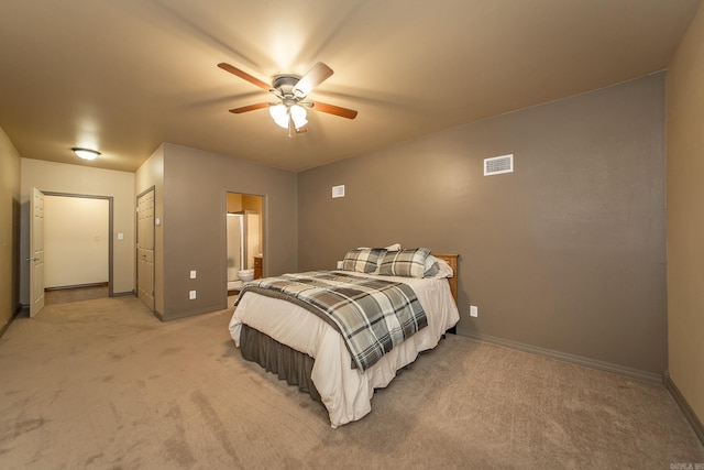 bedroom with baseboards, light carpet, and visible vents