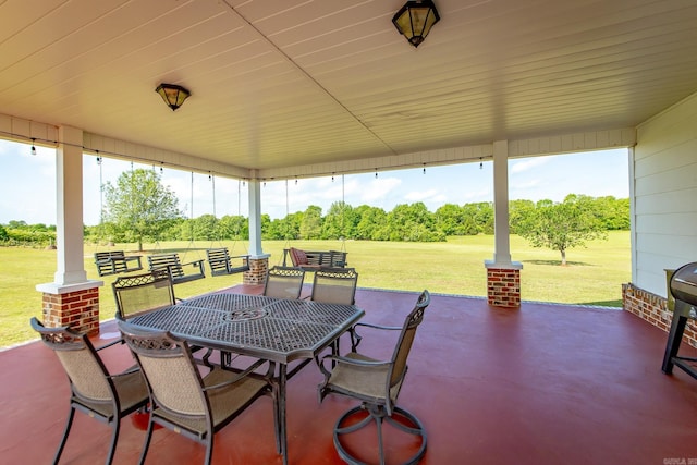 view of patio featuring outdoor dining area