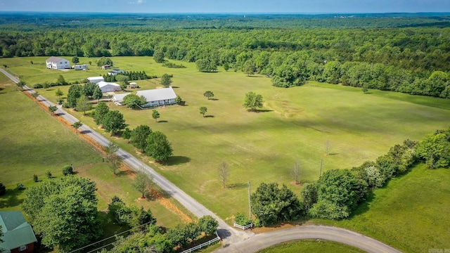 drone / aerial view with a wooded view