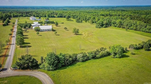 aerial view featuring a wooded view