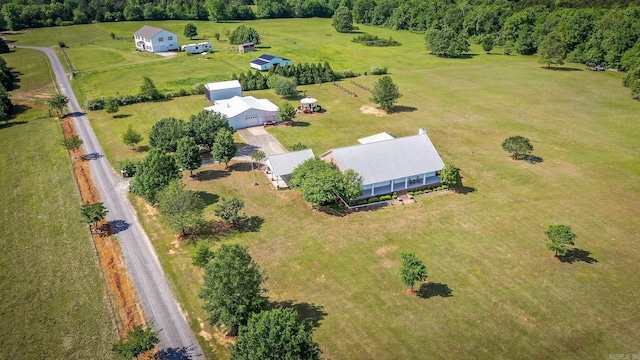 birds eye view of property with a rural view