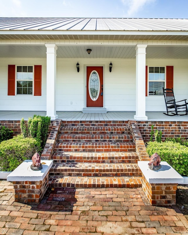 doorway to property with a porch