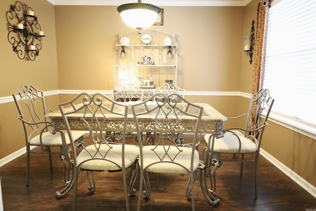3302 Willow Ln, Paragould, AR 72450 - dining space featuring crown molding, baseboards, and wood finished floors