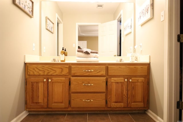 3302 Willow Ln, Paragould, AR 72450 - bathroom featuring double vanity, tile patterned floors, baseboards, and visible vents