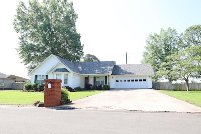 3302 Willow Ln, Paragould, AR 72450 - ranch-style house featuring fence, an attached garage, driveway, and a front lawn