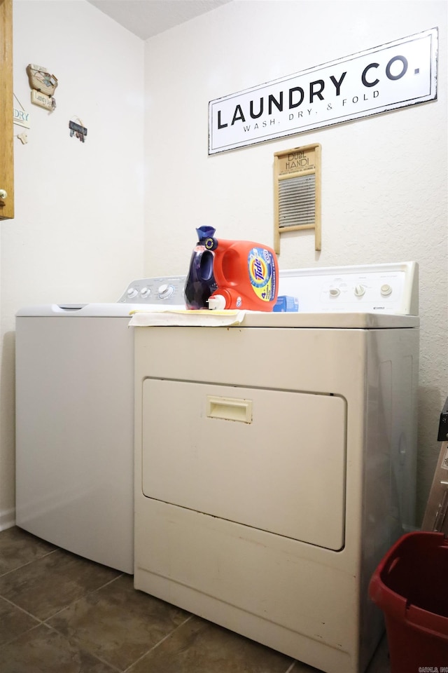 3302 Willow Ln, Paragould, AR 72450 - clothes washing area featuring laundry area, dark tile patterned floors, and independent washer and dryer