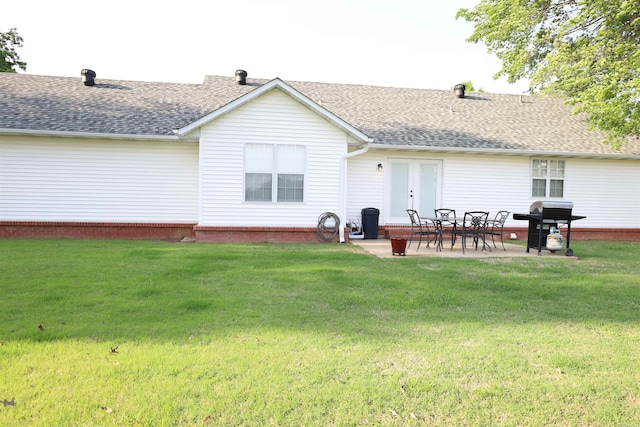 3302 Willow Ln, Paragould, AR 72450 - back of house featuring a patio, a shingled roof, and a yard
