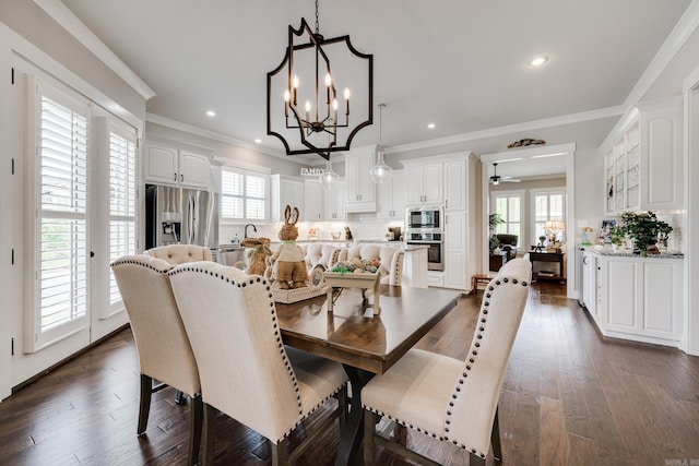 dining space with crown molding, recessed lighting, dark wood finished floors, and plenty of natural light