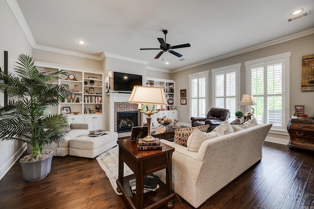 living area with dark wood-style flooring, a brick fireplace, ceiling fan, and baseboards
