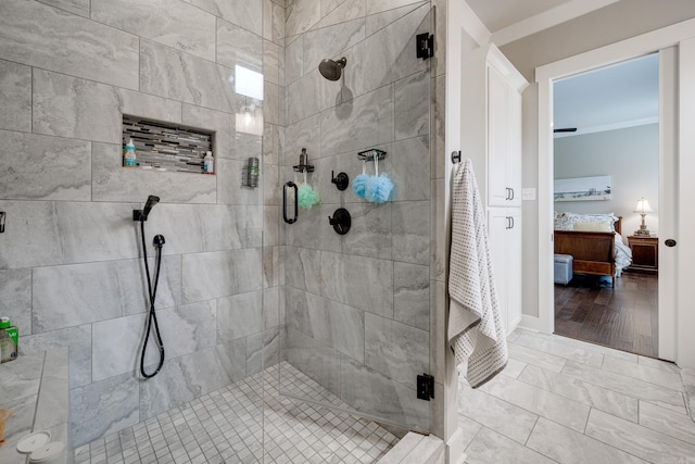 bathroom featuring a shower stall and ensuite bathroom