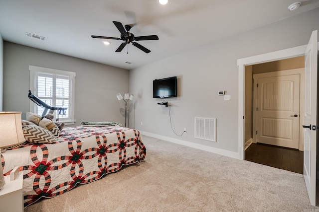 bedroom with visible vents, carpet flooring, and baseboards