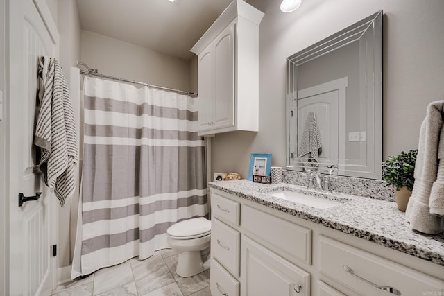 full bathroom featuring vanity, marble finish floor, a shower with shower curtain, and toilet