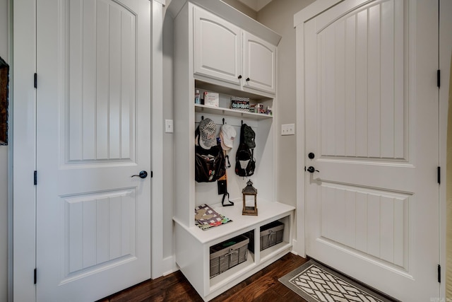 mudroom with dark wood finished floors