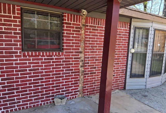 exterior space featuring brick siding