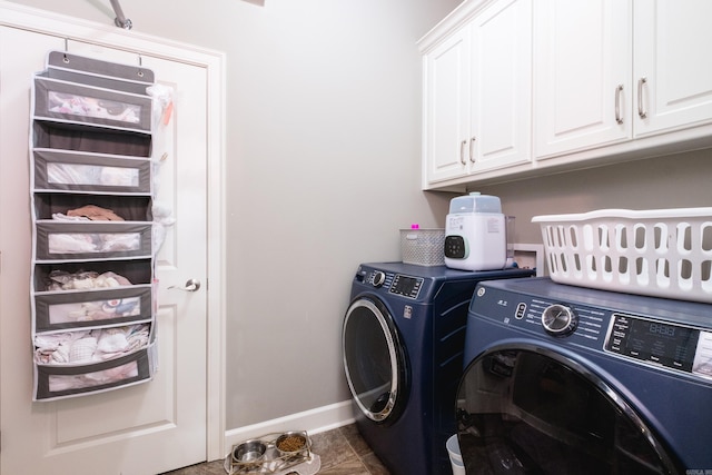 clothes washing area with cabinet space, separate washer and dryer, baseboards, and tile patterned flooring