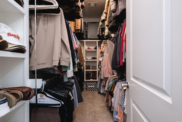 spacious closet featuring visible vents and carpet