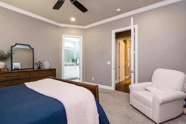 bedroom featuring crown molding, baseboards, ceiling fan, connected bathroom, and carpet flooring