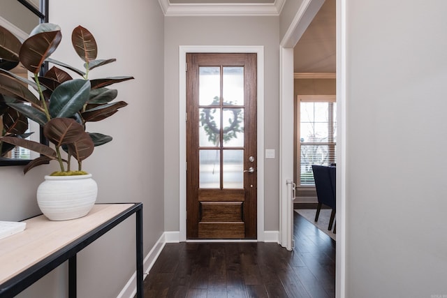 doorway featuring baseboards, ornamental molding, and dark wood finished floors