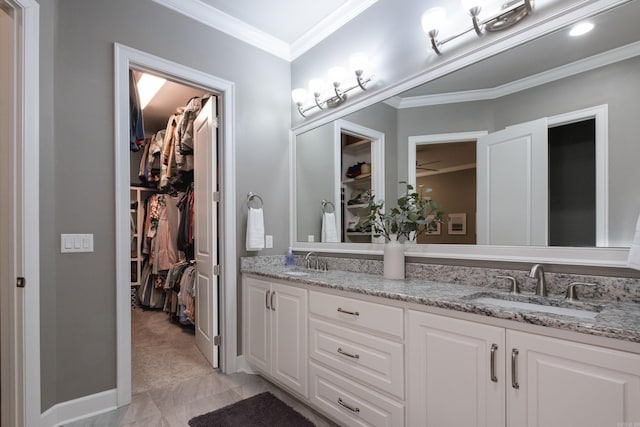 bathroom featuring a sink, crown molding, and double vanity