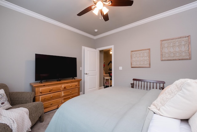 bedroom featuring crown molding, ceiling fan, and carpet floors