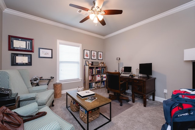 office space featuring crown molding, carpet floors, a ceiling fan, baseboards, and visible vents