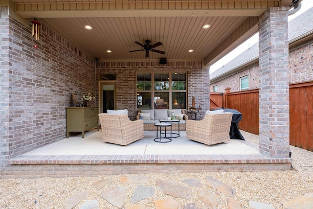 view of patio with a ceiling fan, outdoor lounge area, and fence