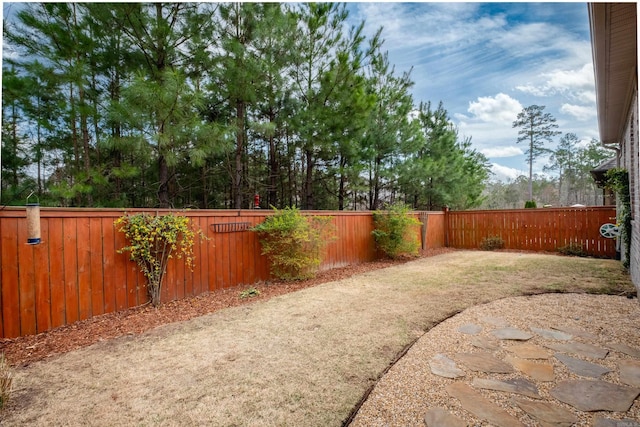 view of yard with a fenced backyard