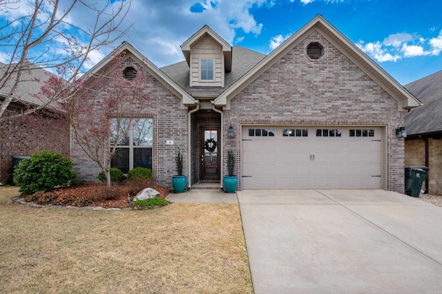 view of front facade featuring a garage, a front lawn, brick siding, a shingled roof, and concrete driveway