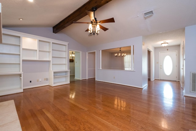 unfurnished living room with vaulted ceiling with beams, baseboards, ceiling fan with notable chandelier, and wood finished floors