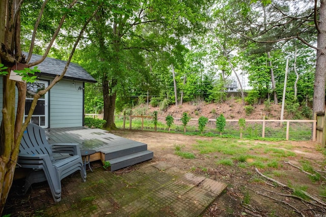 view of yard with a deck and a fenced backyard