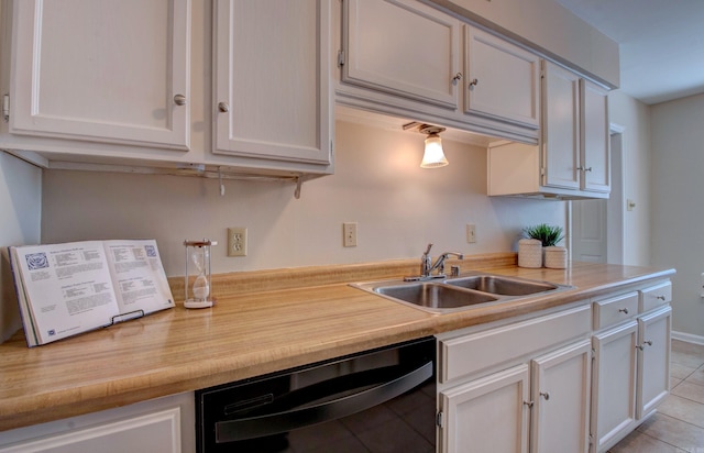 2200 Andover Ct, Little Rock, AR 72227 - kitchen featuring a sink, light countertops, black dishwasher, and light tile patterned flooring