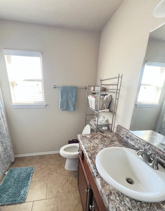 4630 Bedrock Dr, Jonesboro, AR 72404 - bathroom with vanity, baseboards, and toilet