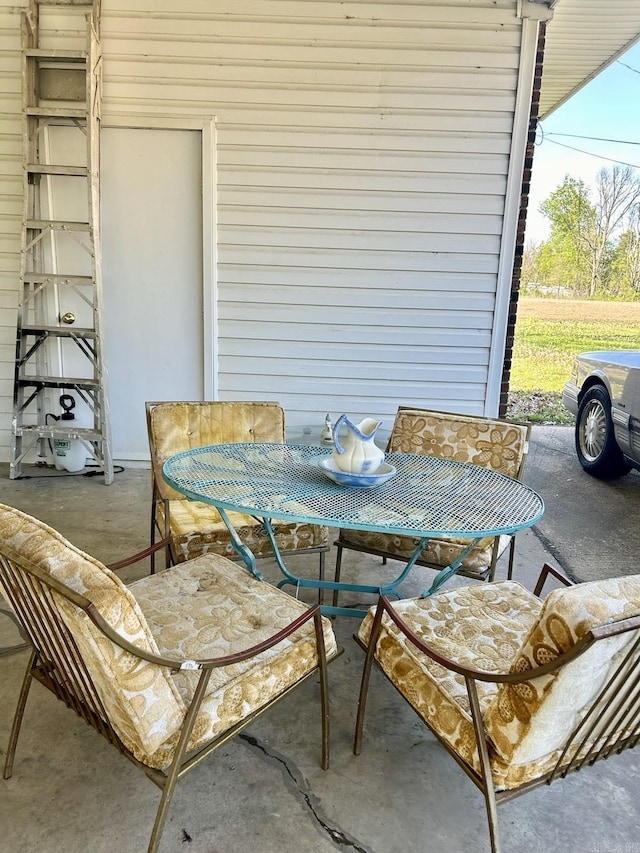 view of patio featuring outdoor dining area