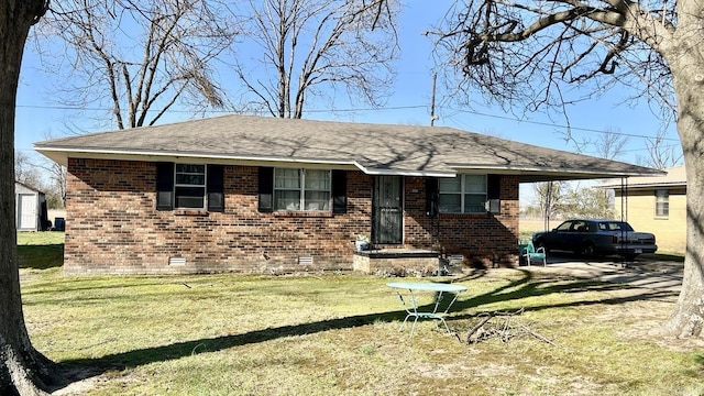 single story home with a front lawn, roof with shingles, an attached carport, brick siding, and crawl space