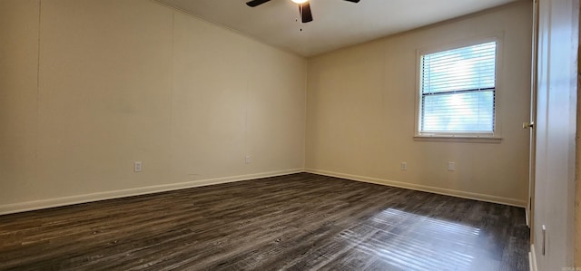 unfurnished room with baseboards, a ceiling fan, dark wood-style flooring, and crown molding