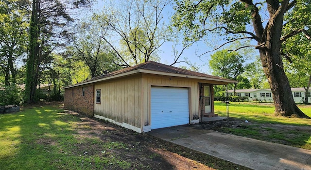 detached garage with concrete driveway